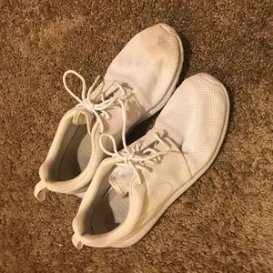 All white Nike  Roshe runs